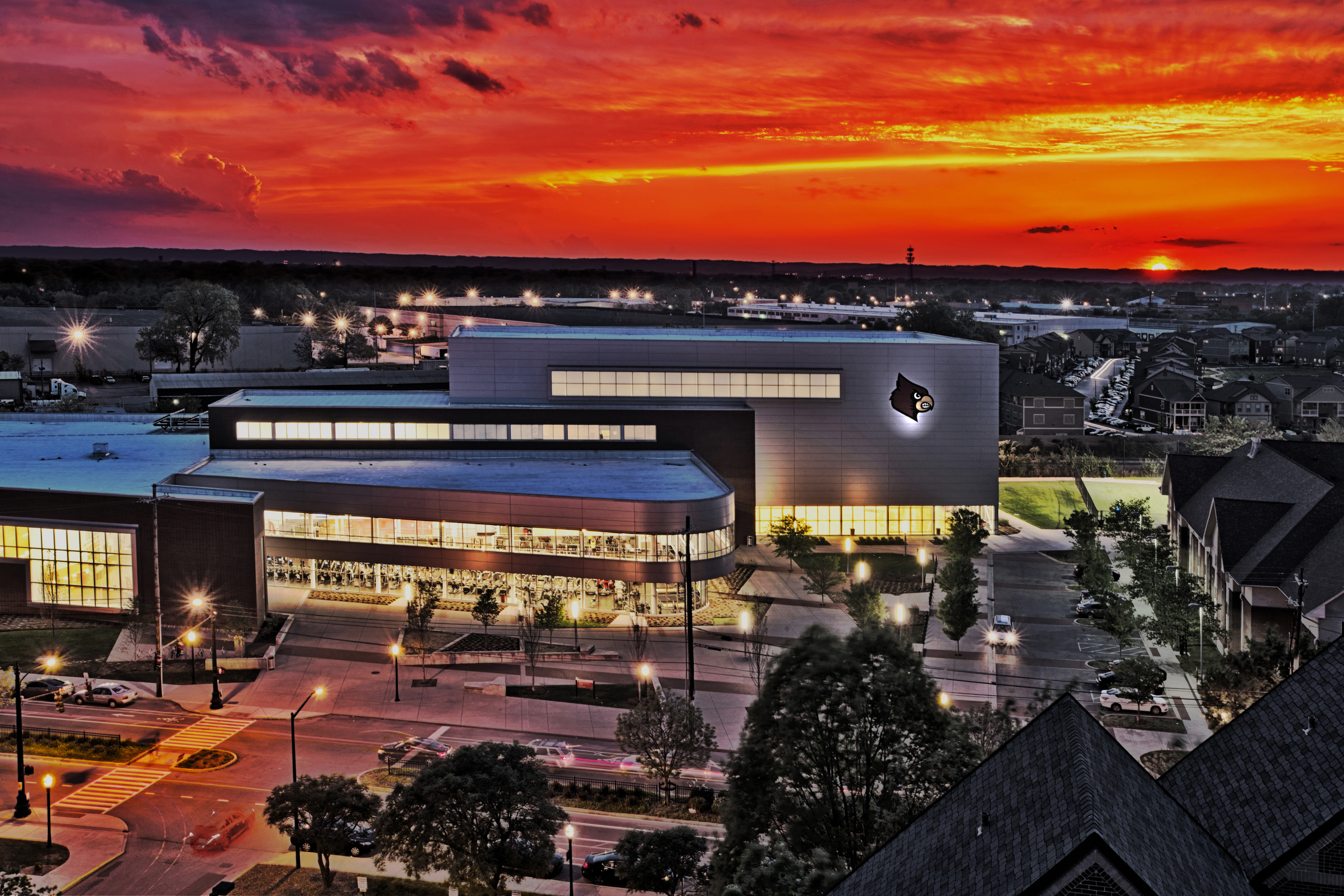 Student Recreation Center with a sunset behind it