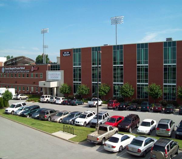 Campus Health building with cars in the parking lot