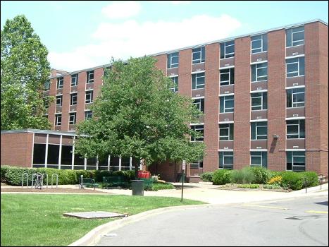 Stevenson Hall, a sidewalk with a bicycle rack, and a few trees